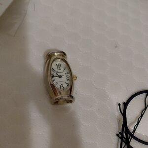 Gold Oval Watch with White Face